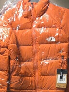 The North Face Orange Insulated Puffer Jacket.  New Still In Plastic